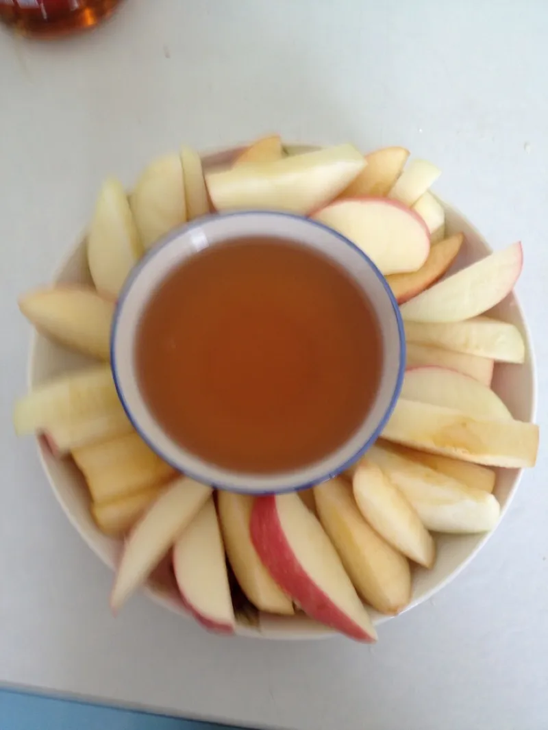 A spread of classic Ashkenazi dishes including challah, gefilte fish, and brisket