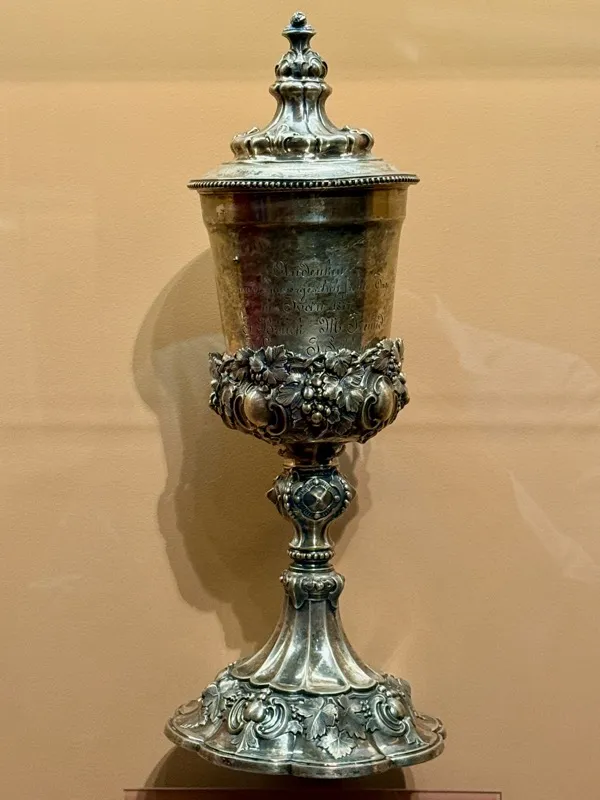 An ornate silver Kiddush cup with lid, likely from Austria-Hungary, 1877
