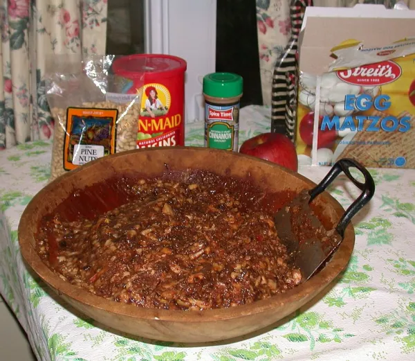 Chopped apples and walnuts being mixed for Ashkenazi charoset