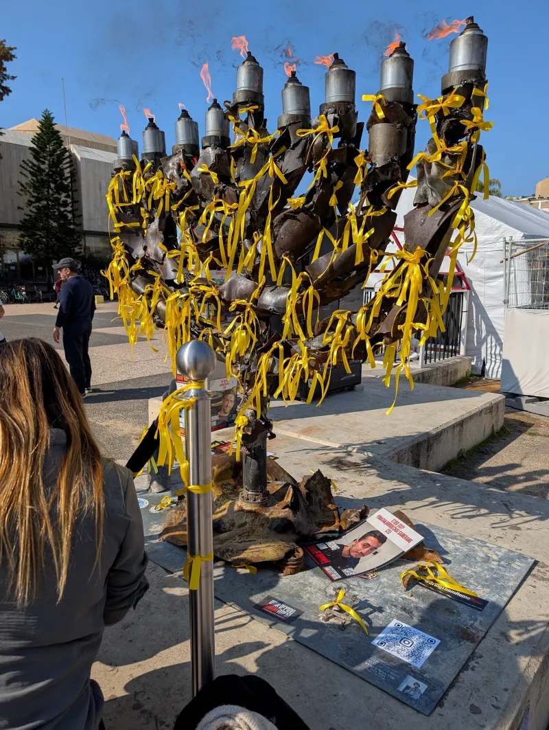 A Hanukkah menorah (hanukkiah) with all candles lit