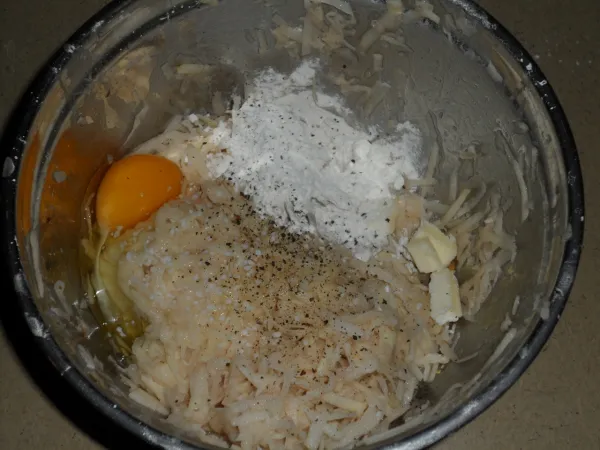 Golden latkes (potato pancakes) frying in oil for Hanukkah