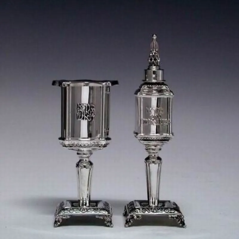 Havdalah ceremony set with braided candle, spice box, and wine cup