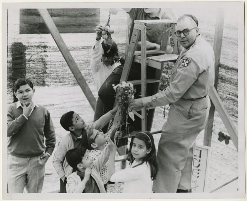 Decorated sukkah with schach roof and hanging decorations