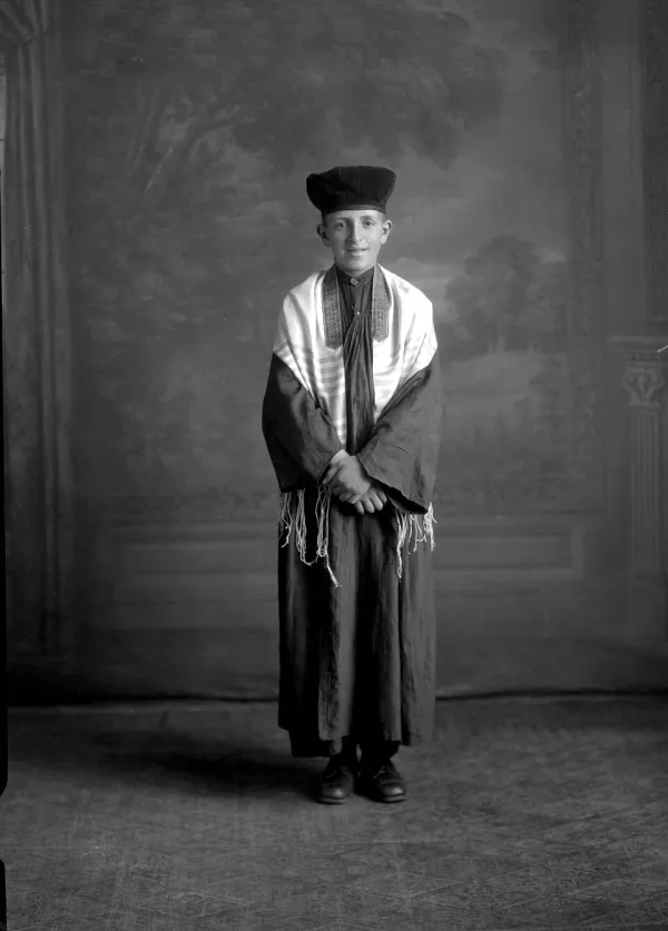 Step-by-step illustration of putting on a tallit