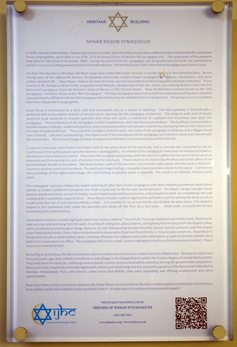 Interior of an ornate historic synagogue with arched ceilings and stained glass