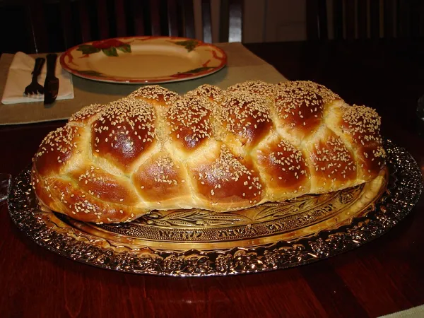 A table set with various traditional Shabbat dishes