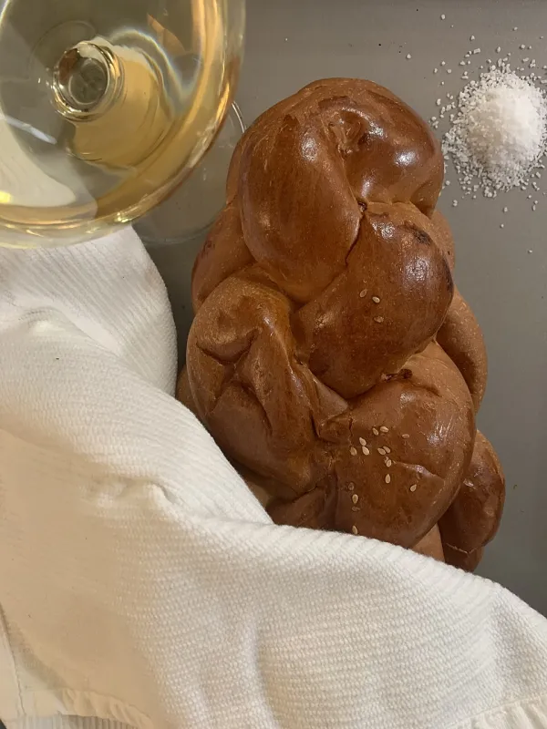 A traditional two-handled washing cup used for ritual hand washing