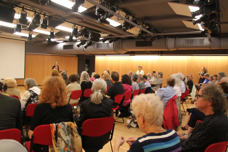 An ornate Broadway theater marquee illuminated at night