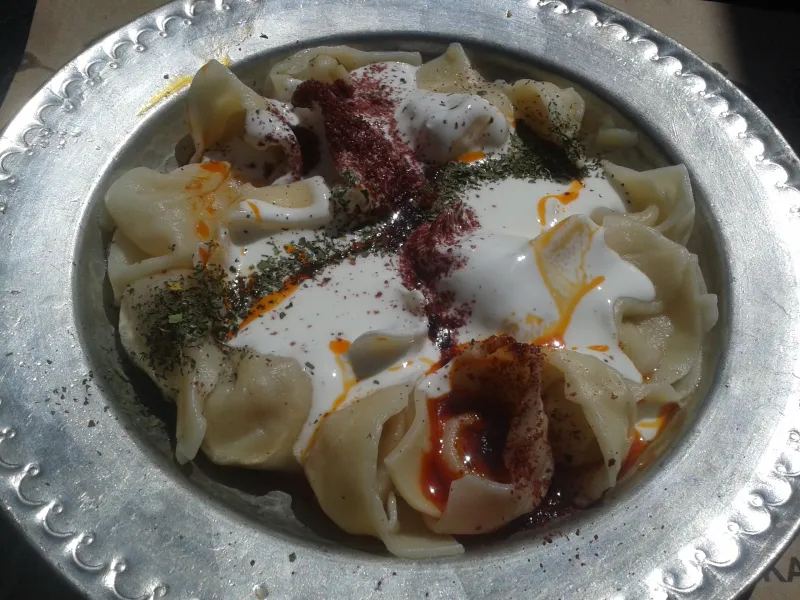 A colorful spread of plant-based Israeli foods including hummus and salads