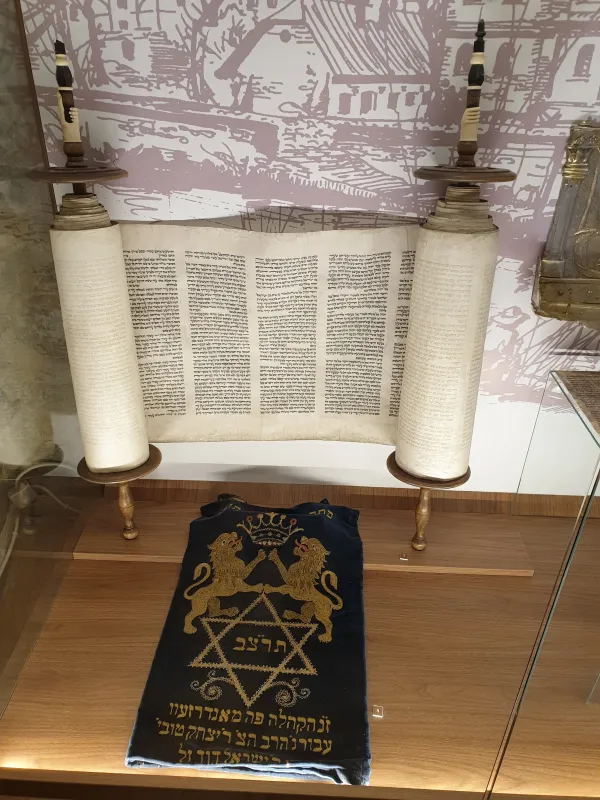 Torah scrolls preserved in a museum — symbols of Jewish heritage passed down through generations