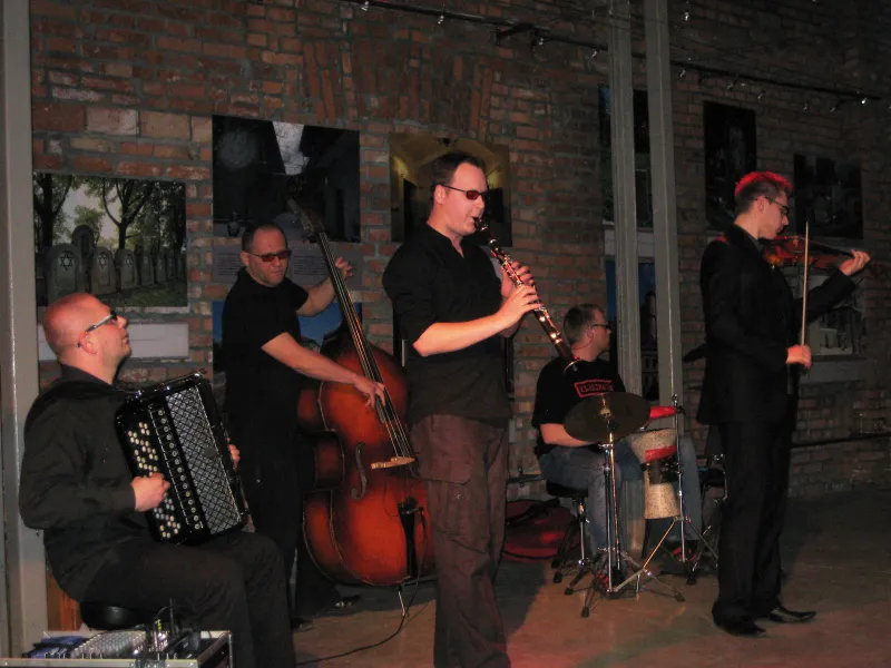 A klezmer band performing with traditional instruments