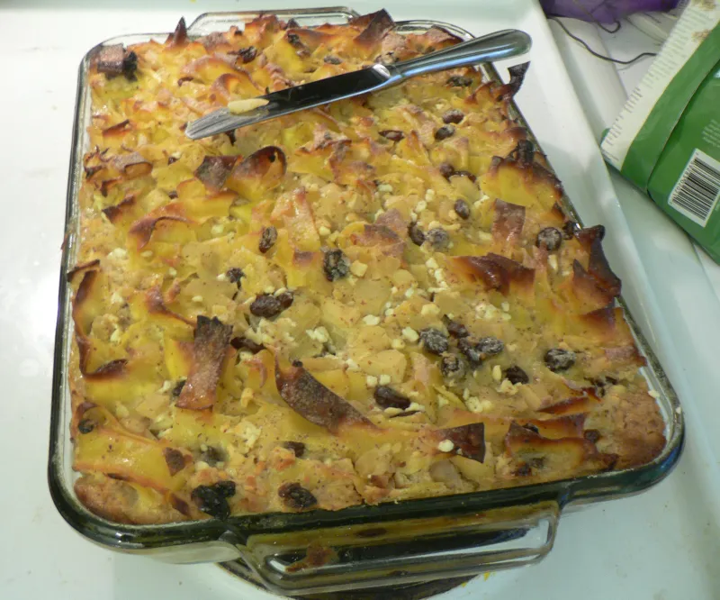 Golden-topped noodle kugel in a baking dish fresh from the oven