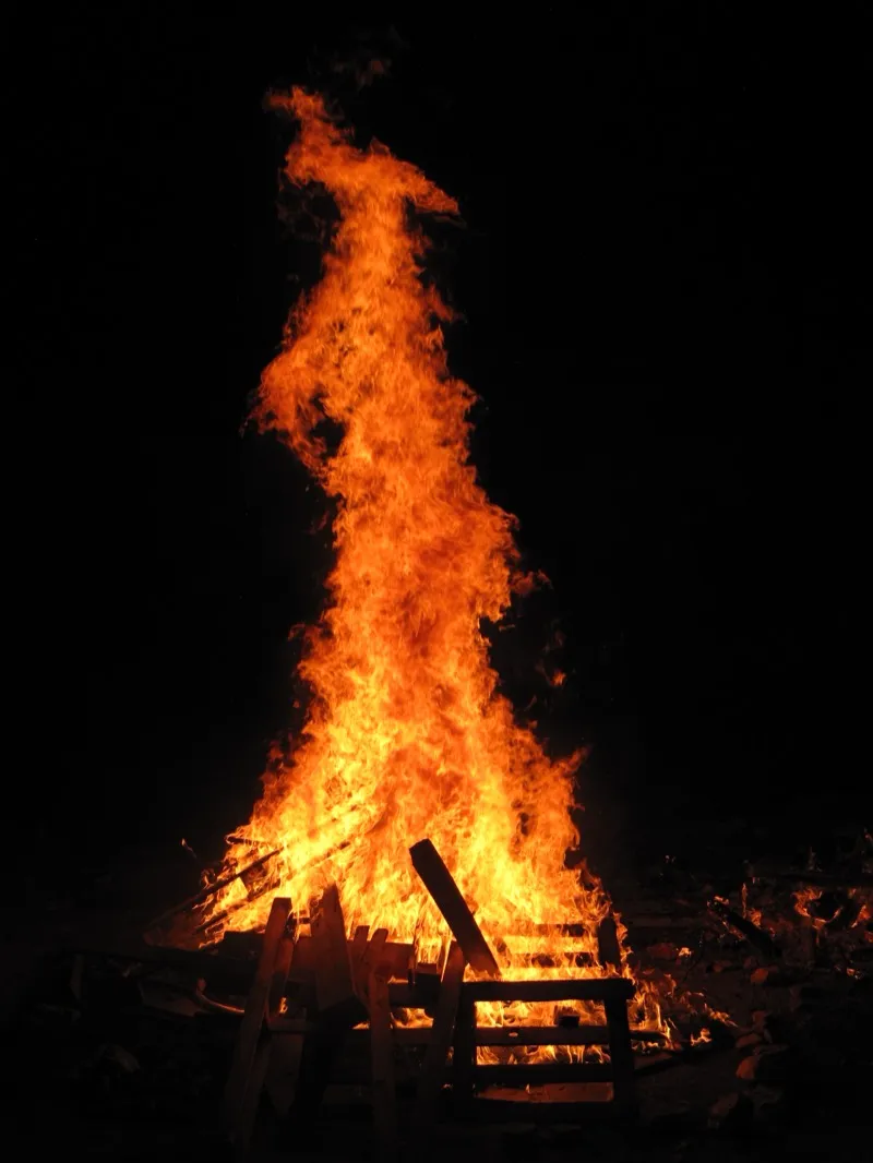 A Lag BaOmer bonfire burning brightly at night
