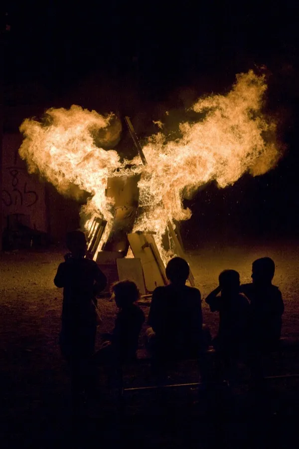 A Lag BaOmer bonfire burning on a beach in Tel Aviv, Israel