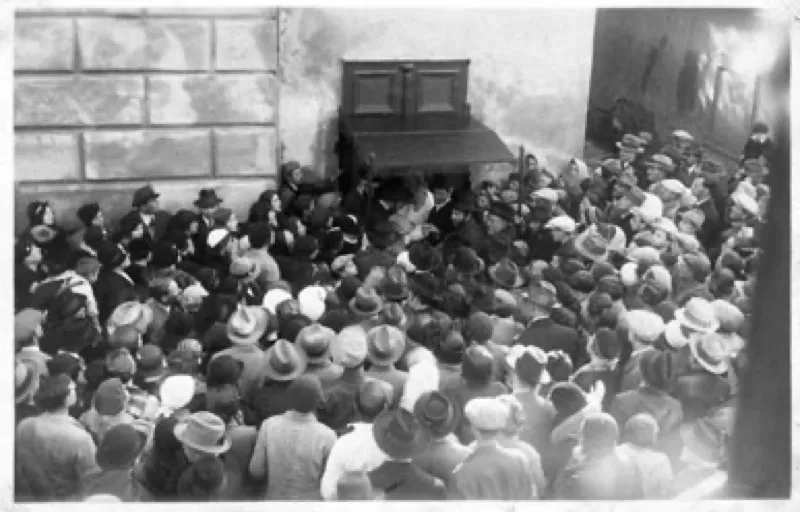Celebration scene with guests raising glasses after a Jewish milestone event