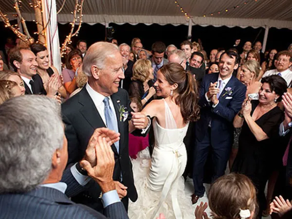 Guests celebrating at a Jewish wedding reception, throwing confetti
