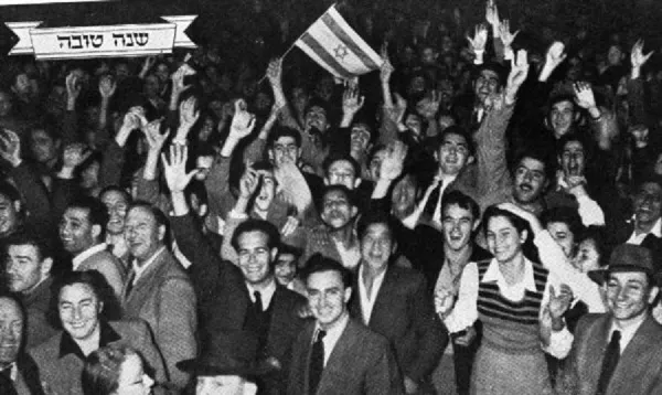 Crowds cheering and waving Israeli flags on Independence Day in Tel Aviv, May 14, 1948