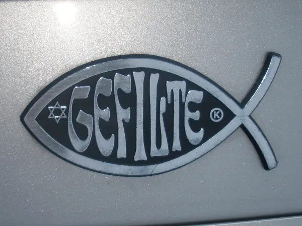 A vintage Yiddish newspaper with expressive headlines