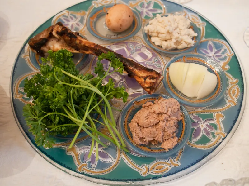 A traditional Passover Seder plate showing the six symbolic foods