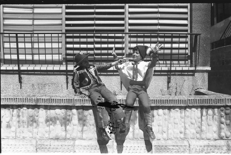 Children in colorful costumes celebrating Purim