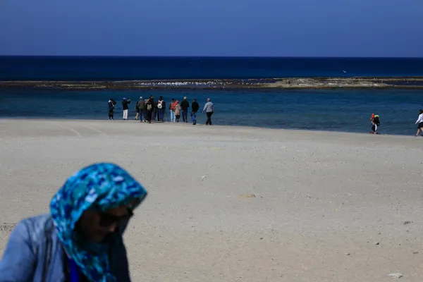 Jews gathering at a river for the Tashlich ceremony on Rosh Hashanah