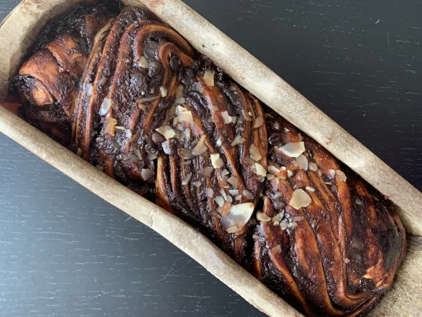 Golden baked rugelach cooling on a wire rack