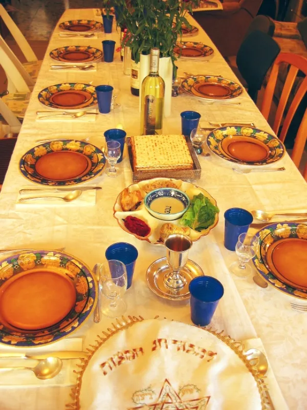 An ornate antique seder plate with Hebrew inscriptions and decorative motifs
