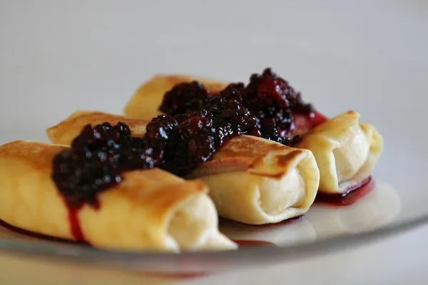 Cheese blintzes with blackberries, a traditional Shavuot dairy dish