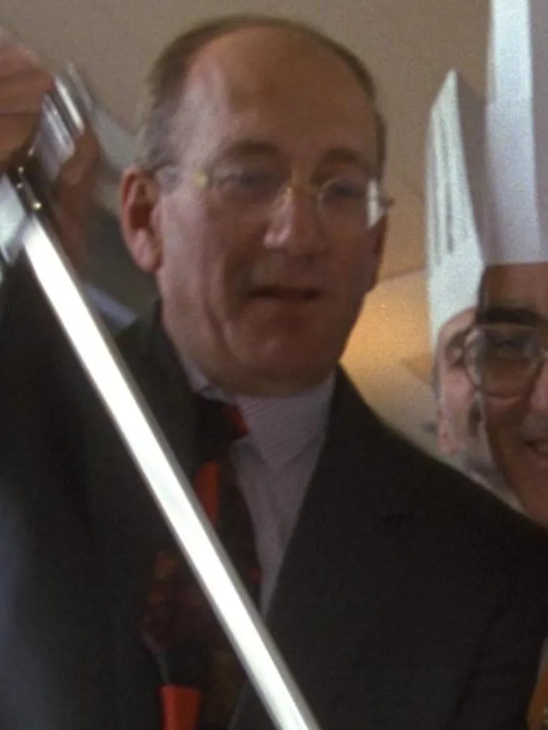 Pile of golden sufganiyot dusted with powdered sugar