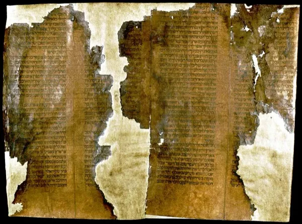 An ancient Torah scroll manuscript showing Hebrew text