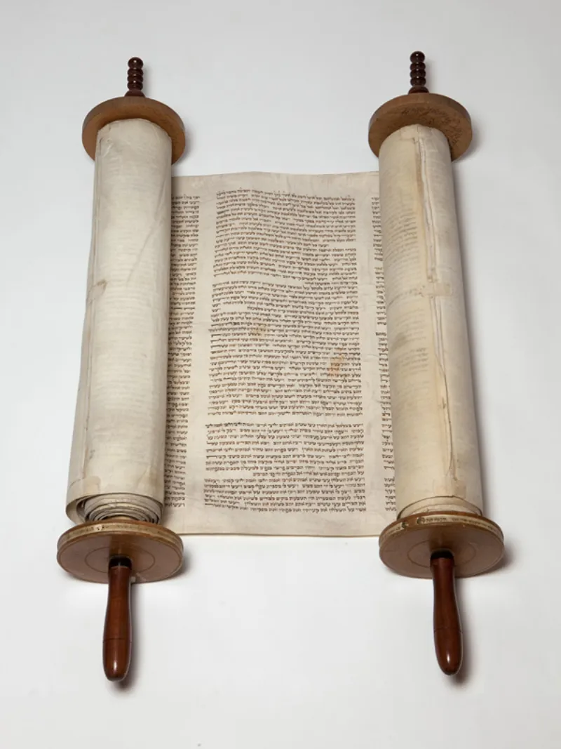 A historic Torah scroll — the source of Jewish dietary laws including the prohibition against pork