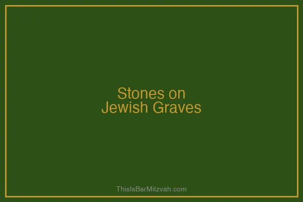 A hand placing a small stone on a Jewish headstone in an act of remembrance