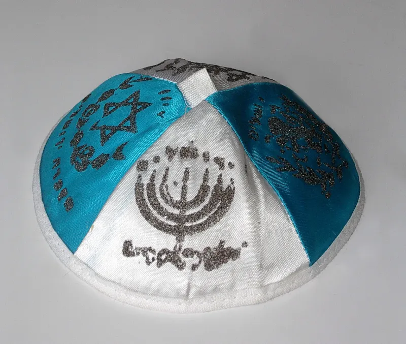 A collection of colorful kippot (yarmulkes) on display — the Jewish head covering worn as a sign of reverence