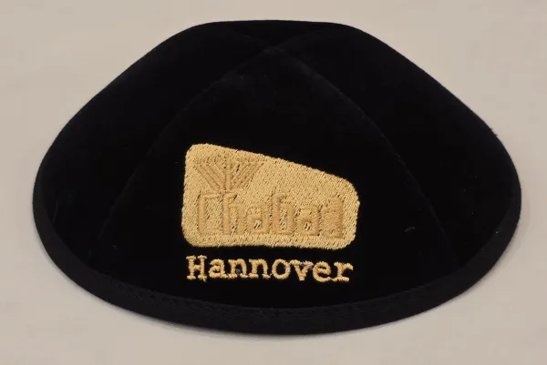 Kippot displayed in a shop — showing the variety of styles available from knitted to velvet