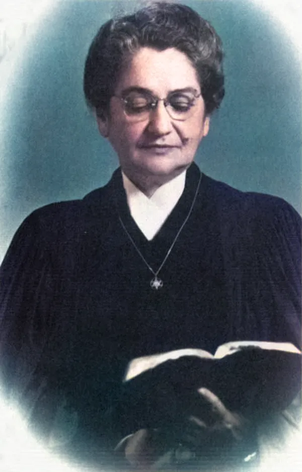 A woman rabbi leading a congregation in prayer