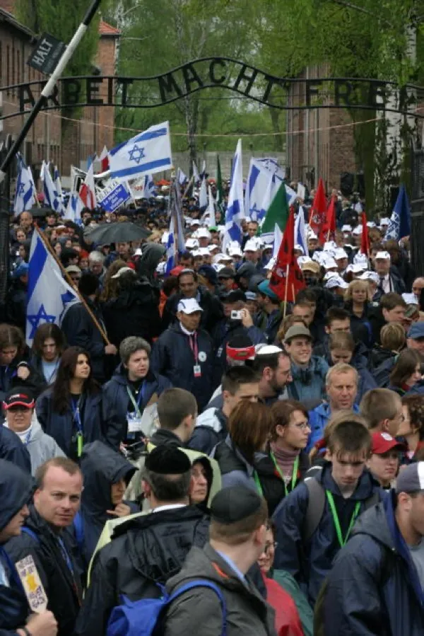 Participants in the March of the Living walking through Auschwitz-Birkenau